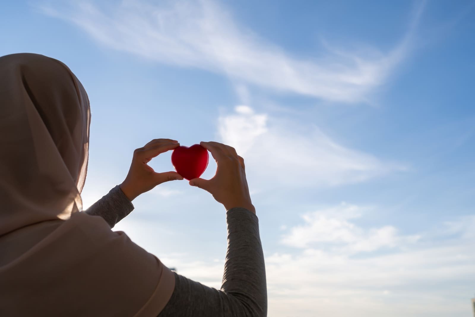 Hands forming the shape of a heart
