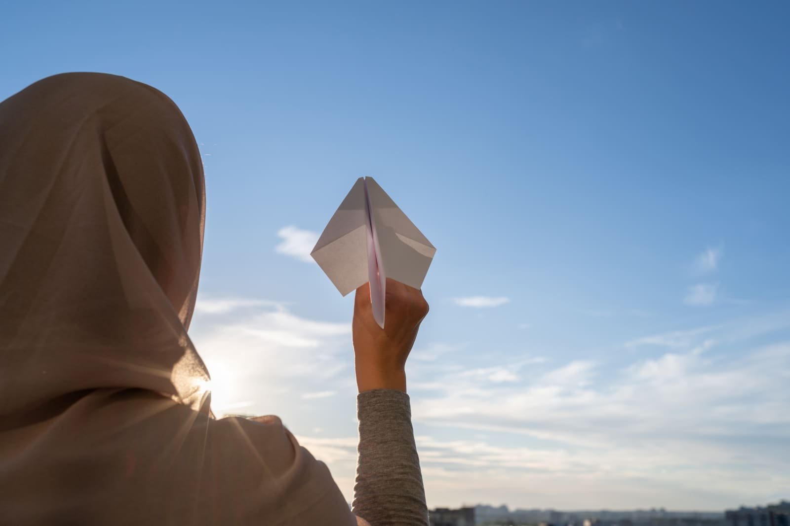 A paper plane in flight